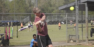 player swinging at a baseball