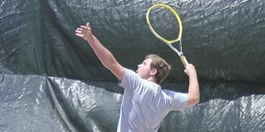 tennis player serving a shot