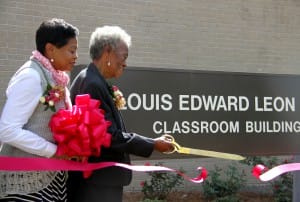 Dorothy Shannon Lee, widow of Louis Lee, cuts the ribbon for the new Louis Edward Leon Lee Classroom Building on the Utica Campus with the help of her daughter, Dr. Clara Lee.