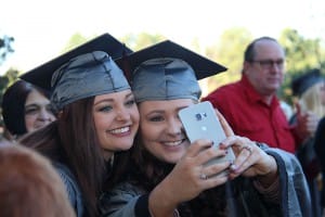 Haley Wilson of Brandon, left, and Emily Stewart of Braxton take a selfie after receiving their dental assisting degrees from Hinds Community College on Dec. 18.