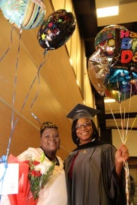 Akelia Graise of Jackson got lots of balloons and flowers from family members after receiving a practical nursing degree from Hinds Community College on Dec. 18. With her is aunt Elizabeth Graise.