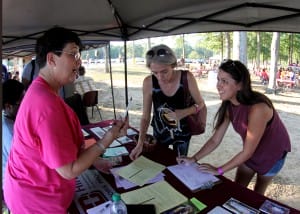 Carlee Edwards, right, and her mother, Vicki Edwards, get information on the Honors Institute at Hinds Community College from Cheryl Bozeman, left, recruiter and admissions secretary for the program and for Phi Theta Kappa, at the Thursday Night Lights recruiting event on the Raymond Campus on Oct. 6. (Hinds Community College/Tammi Bowles)