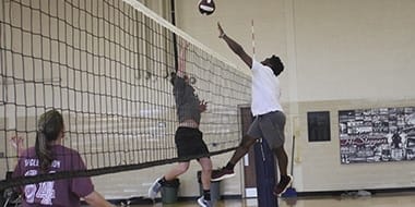 students in a volleyball match