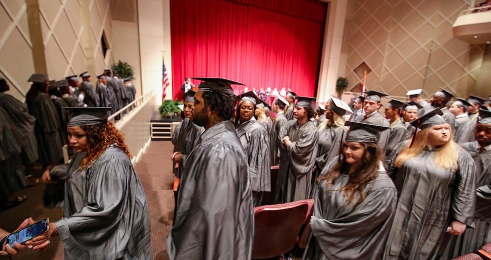 students in cap and gown at graduation ceremony
