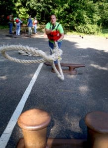 student tossing a rope